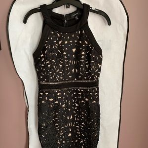 le chateau tight black with lace detailing dress